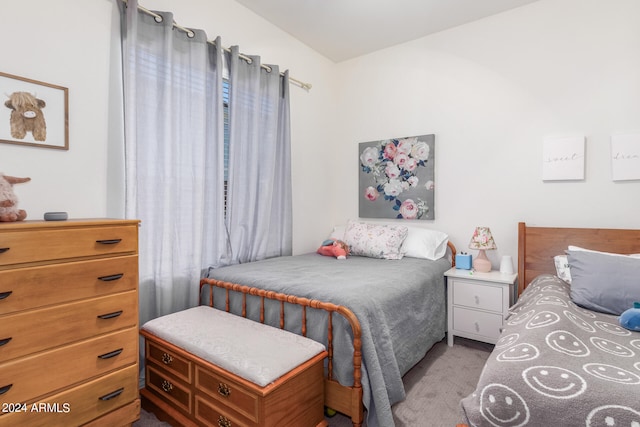 bedroom featuring light carpet