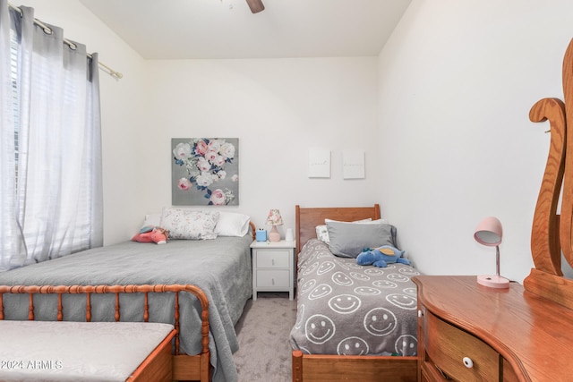 bedroom with ceiling fan and carpet floors