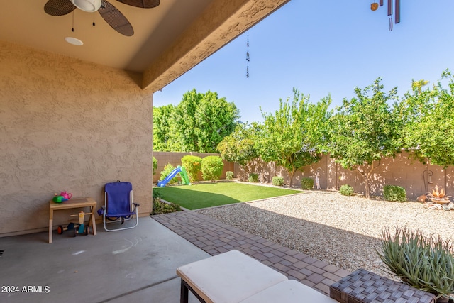 view of patio / terrace featuring ceiling fan