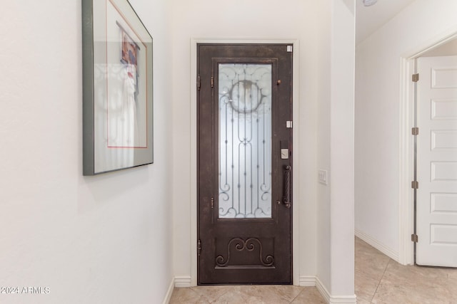 entrance foyer featuring light tile patterned flooring