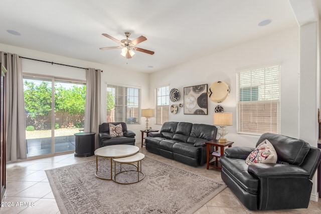 living room featuring light tile patterned floors and ceiling fan