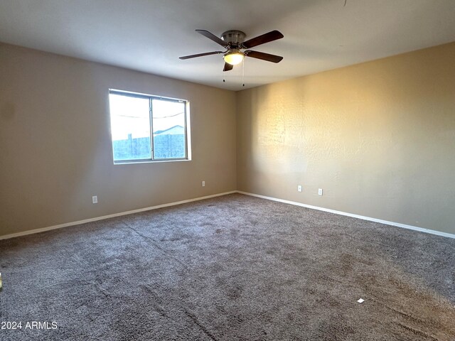 carpeted empty room with ceiling fan