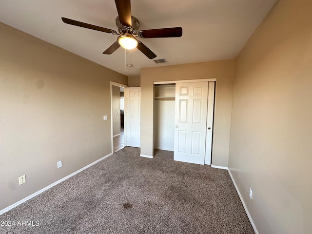 unfurnished bedroom featuring ceiling fan, a closet, and carpet floors