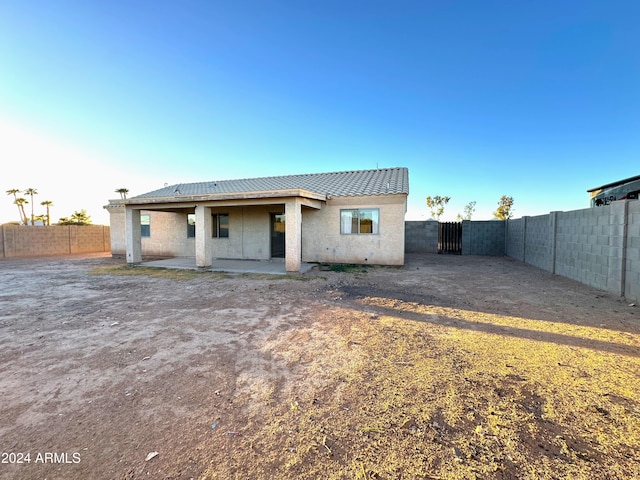 back of house featuring a patio