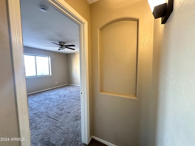 hallway with carpet flooring