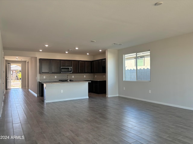 kitchen with hardwood / wood-style flooring, a healthy amount of sunlight, and sink