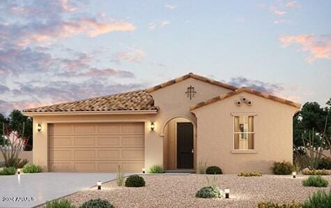 mediterranean / spanish house with a garage