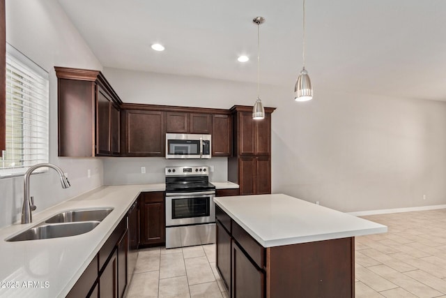2000 N 36th St Unit 20, Phoenix, AZ 85008 - kitchen featuring stainless steel appliances, light tile patterned flooring, light countertops, dark brown cabinetry, and recessed lighting