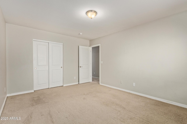 2000 N 36th St Unit 20, Phoenix, AZ 85008 - unfurnished bedroom with light colored carpet and a closet