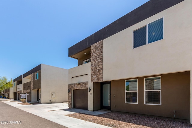 2000 N 36th St Unit 20, Phoenix, AZ 85008 - view of front facade with stone siding, driveway, and stucco siding