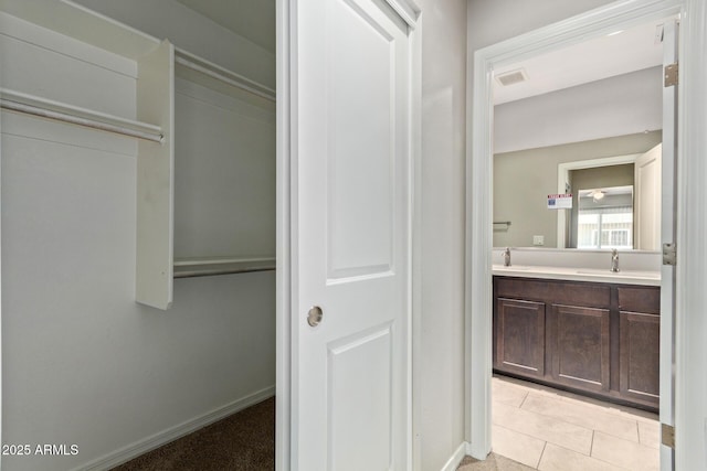 2000 N 36th St Unit 20, Phoenix, AZ 85008 - bathroom with double vanity and tile patterned flooring