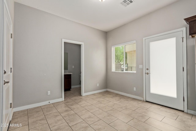 2000 N 36th St Unit 20, Phoenix, AZ 85008 - unfurnished room featuring baseboards and light tile patterned floors