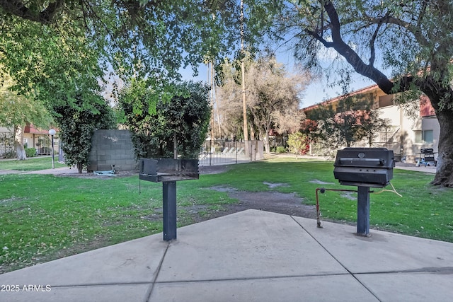 view of community with a patio and a yard