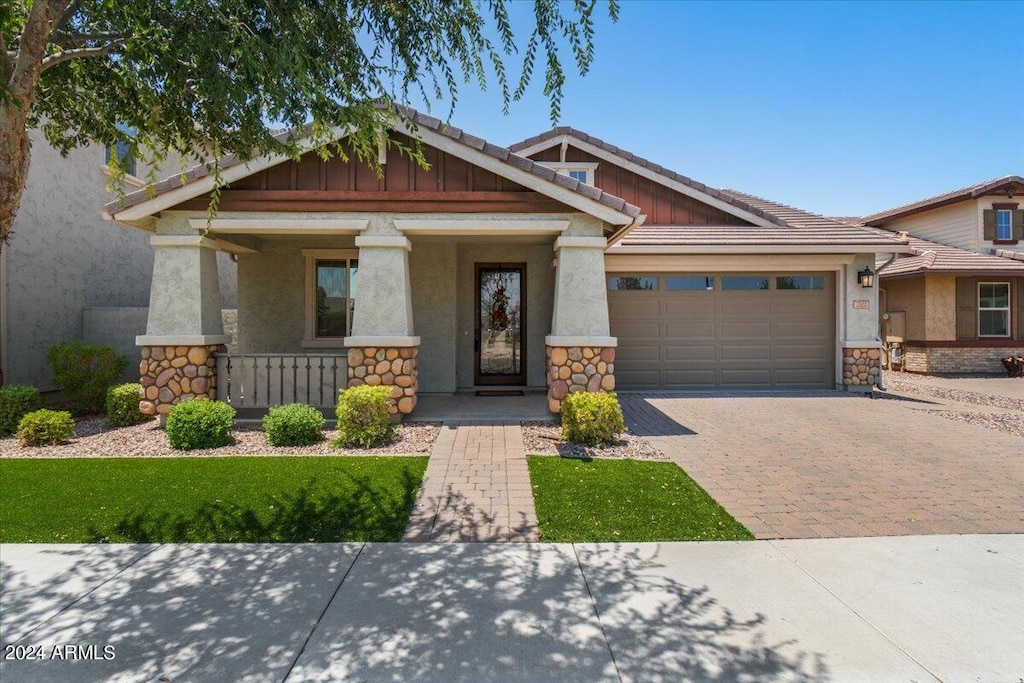 craftsman-style house with a garage and a porch