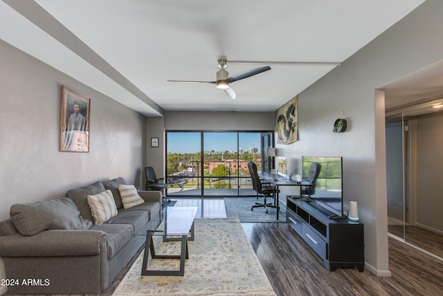 living room with dark hardwood / wood-style floors and ceiling fan