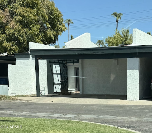 exterior space featuring a carport