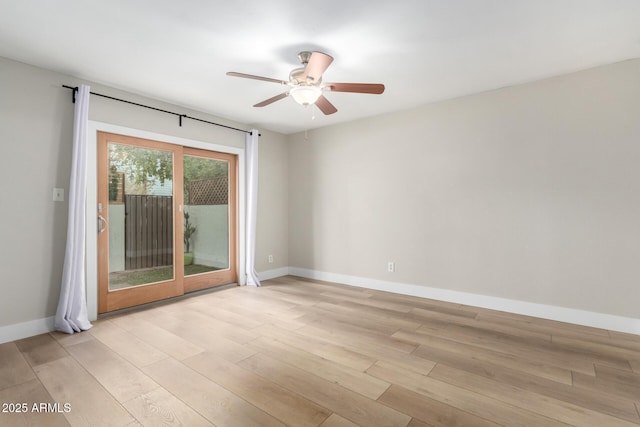 spare room with ceiling fan and light hardwood / wood-style floors