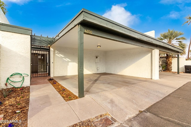 exterior space with a carport