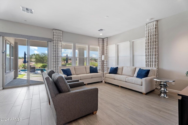 living room with light hardwood / wood-style flooring