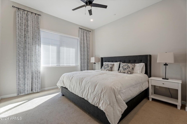 bedroom featuring ceiling fan and light colored carpet