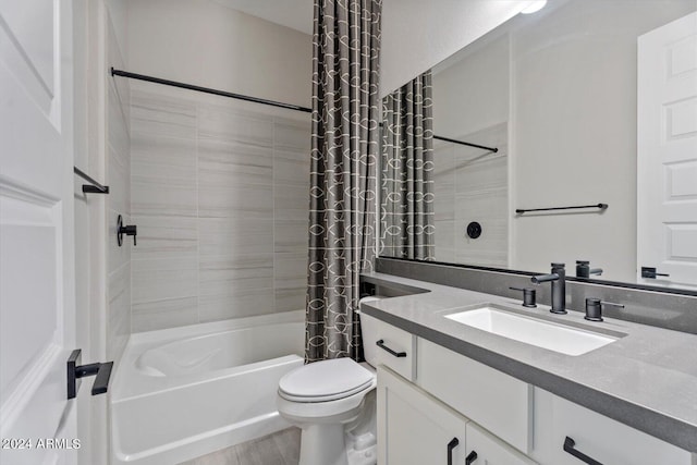 full bathroom featuring wood-type flooring, vanity, toilet, and shower / bathtub combination with curtain