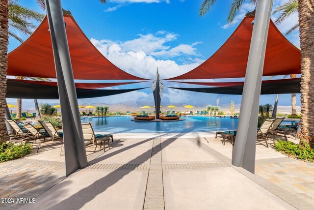 exterior space with a patio and a water and mountain view