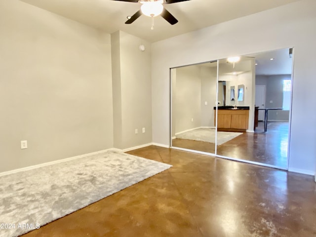 unfurnished bedroom featuring a closet and ceiling fan