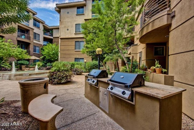 view of patio / terrace featuring an outdoor kitchen and grilling area