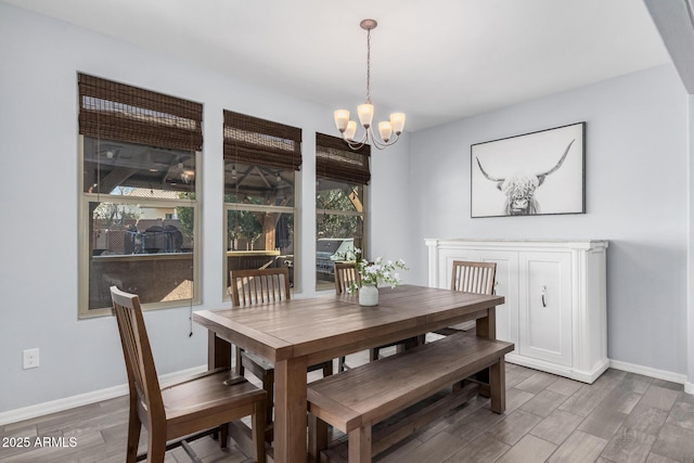 dining area with a notable chandelier