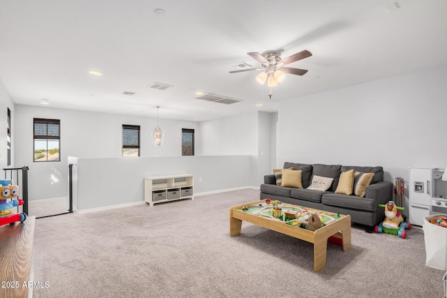 playroom with carpet and ceiling fan