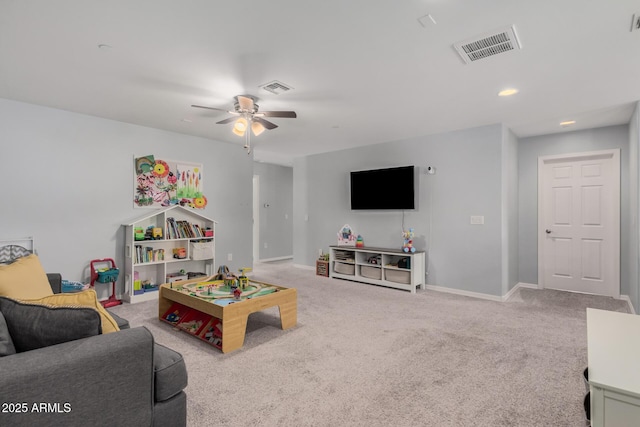 living room with ceiling fan and light carpet