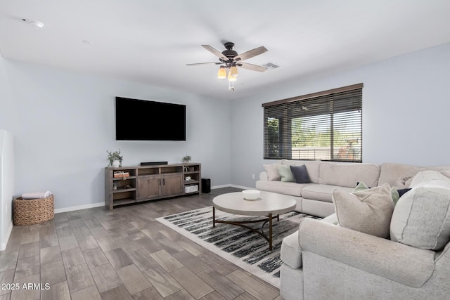 living room with ceiling fan and wood-type flooring