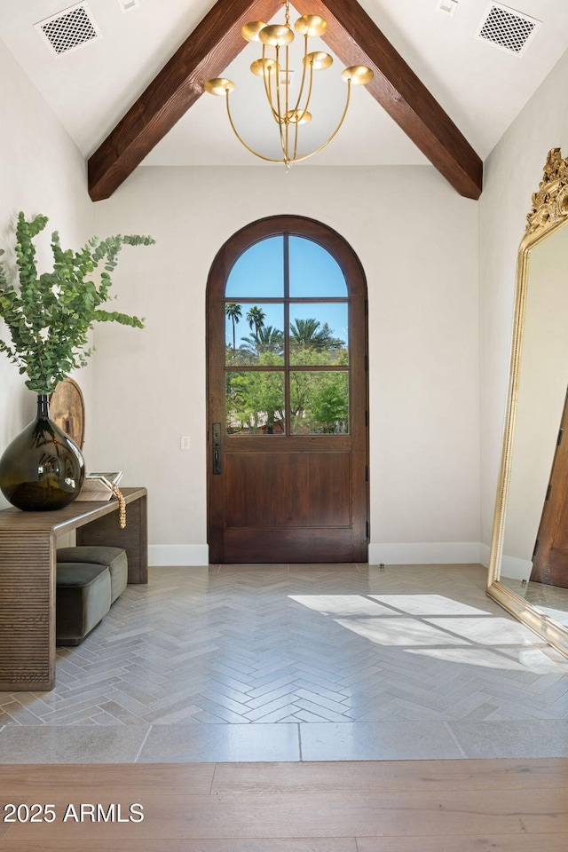 foyer featuring visible vents, arched walkways, beam ceiling, baseboards, and an inviting chandelier