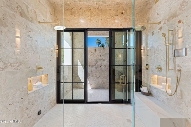 doorway to outside with tile patterned floors and tile walls