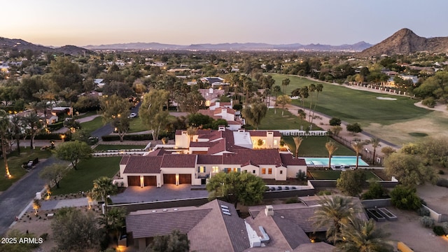 drone / aerial view featuring a mountain view and golf course view