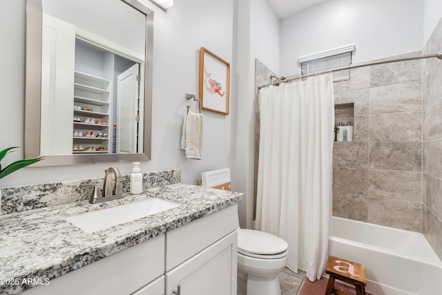 bathroom with toilet, vanity, and shower / tub combo with curtain