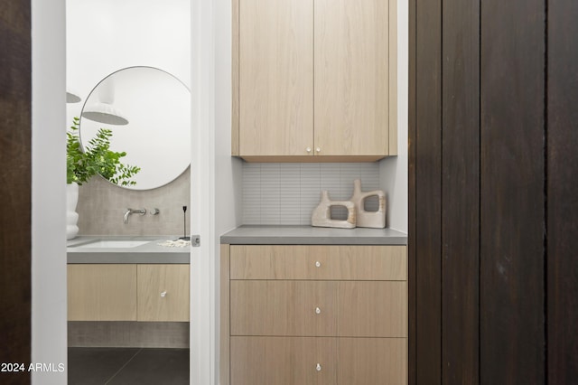 room details with tasteful backsplash and vanity