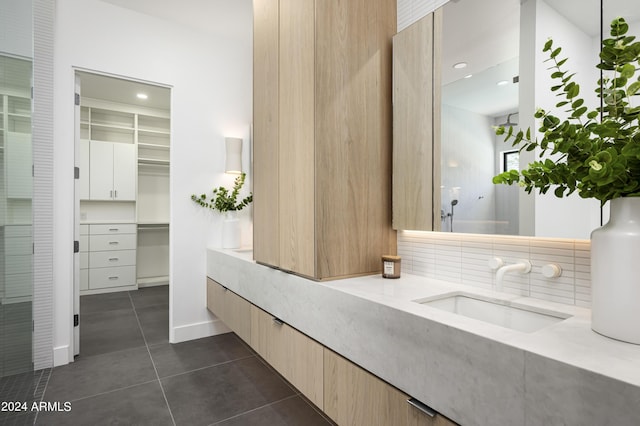 bathroom with vanity, tile patterned flooring, and decorative backsplash