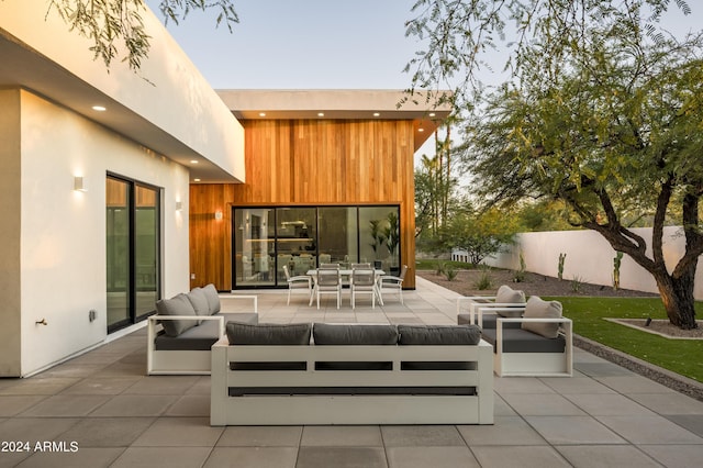 patio terrace at dusk with an outdoor hangout area