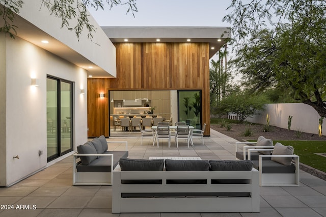 patio terrace at dusk with outdoor lounge area