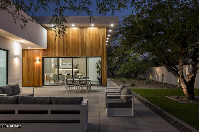 patio at twilight with an outdoor hangout area