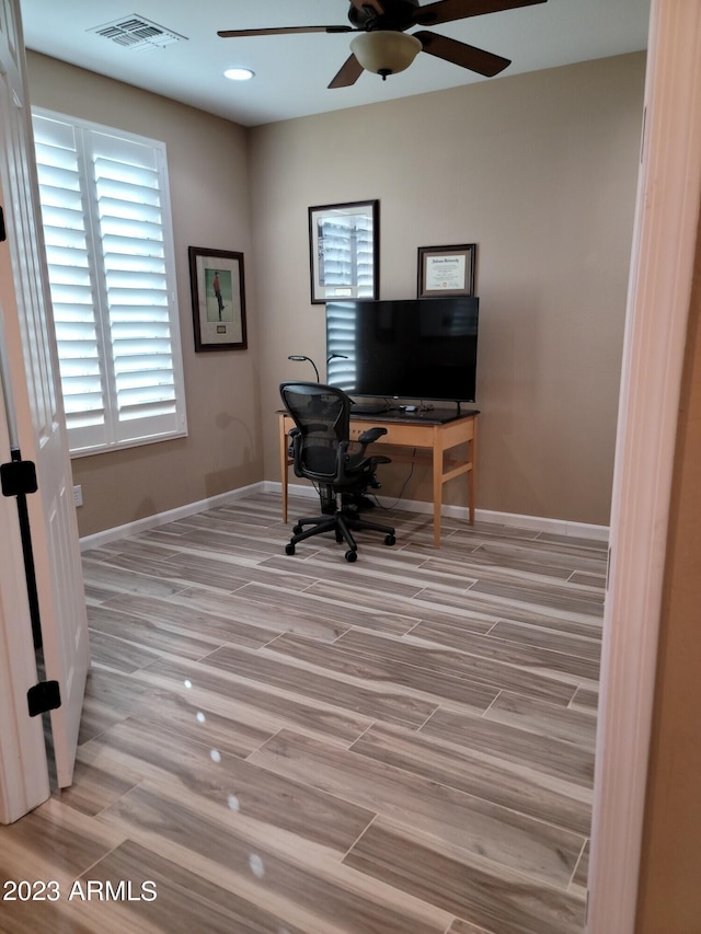 office featuring ceiling fan and hardwood / wood-style flooring