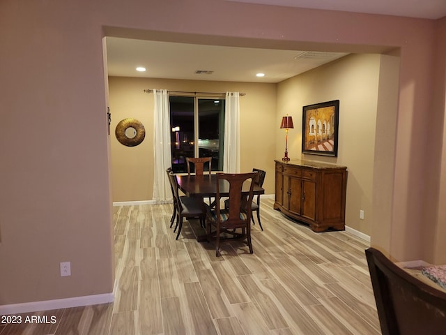 dining space featuring light hardwood / wood-style floors