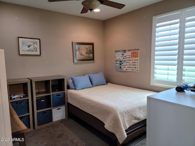 carpeted bedroom featuring ceiling fan