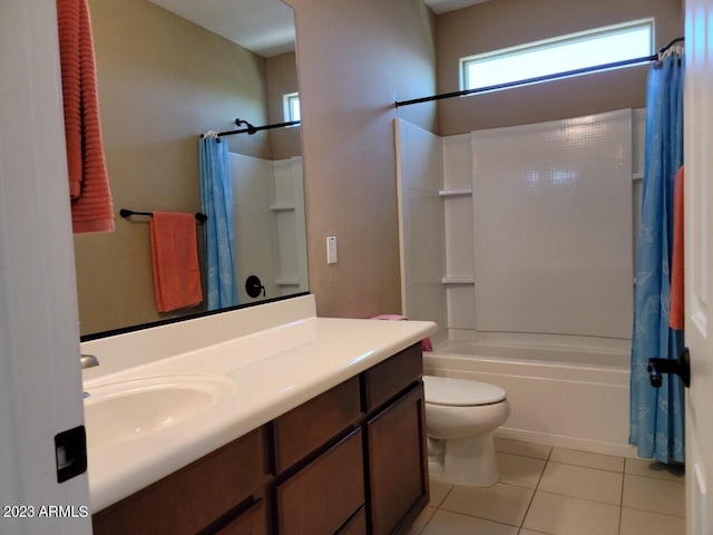 full bathroom with tile flooring, vanity, toilet, and shower / bath combo with shower curtain