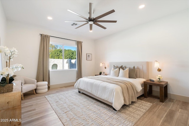 bedroom featuring ceiling fan and light hardwood / wood-style flooring