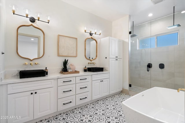 bathroom with tile patterned floors, plus walk in shower, and vanity