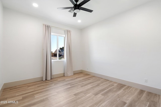 unfurnished room with ceiling fan and light hardwood / wood-style flooring