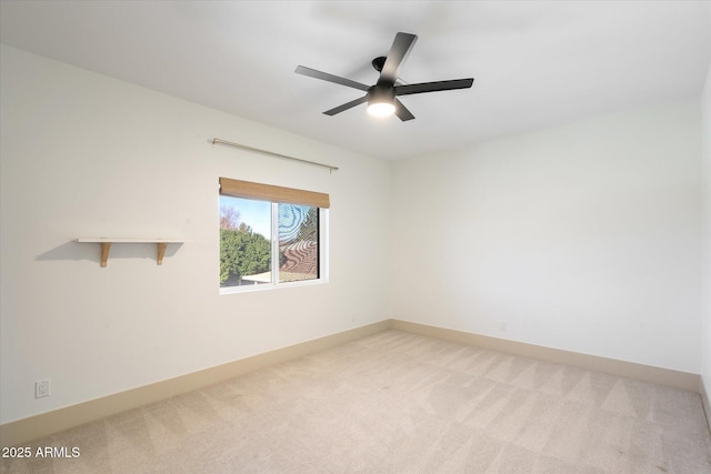 unfurnished room featuring light colored carpet and ceiling fan