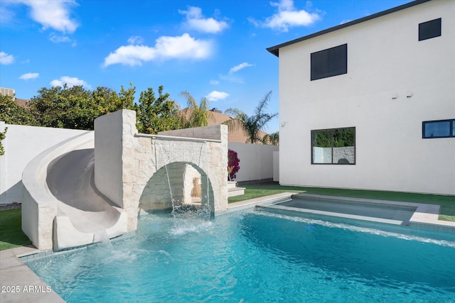 view of swimming pool featuring pool water feature